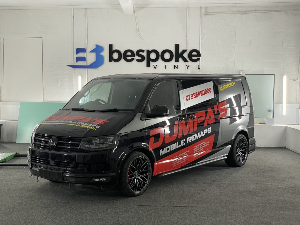 Dumpa's Mobile Remaps black Volkswagen Transporter van wrap